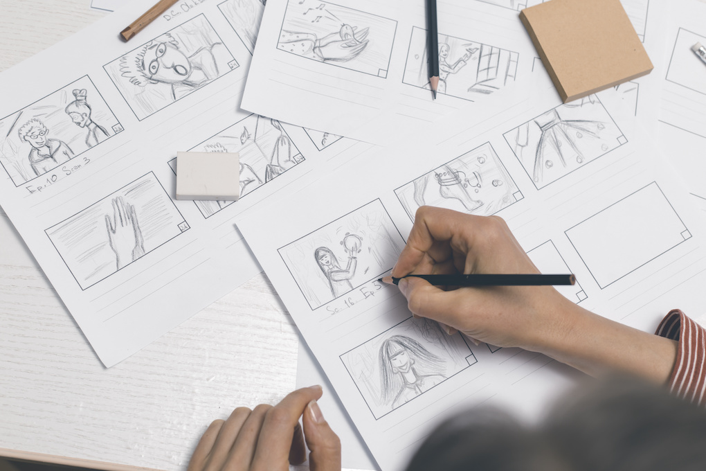 Hands draw a storyboard for filmmaking
