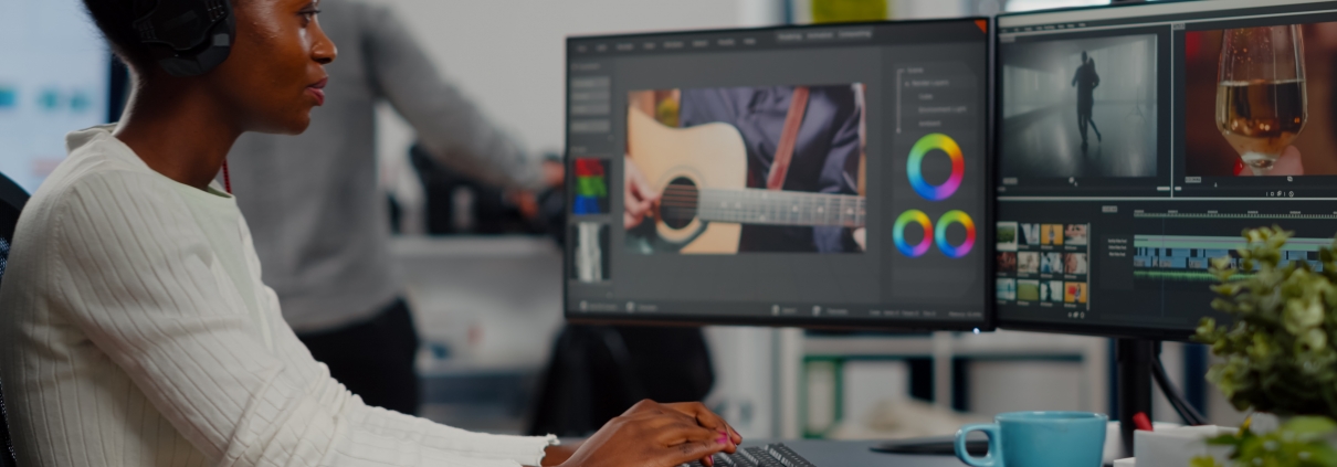 woman editing video content on computer software