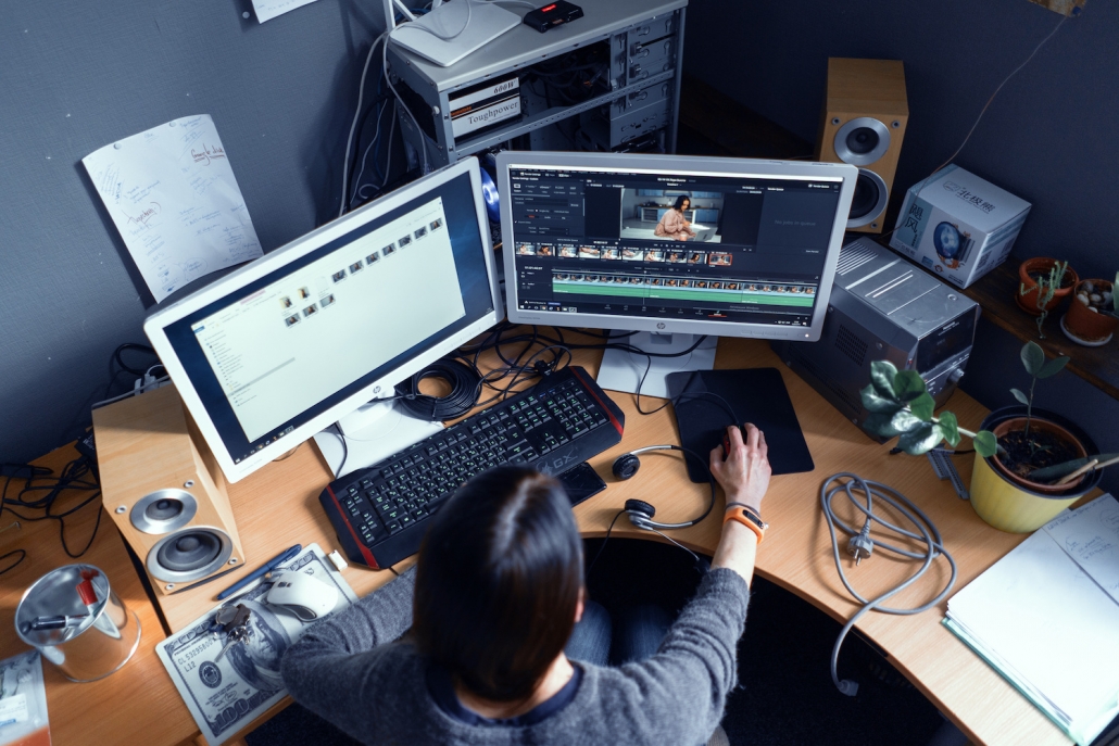woman using film production software at her desk