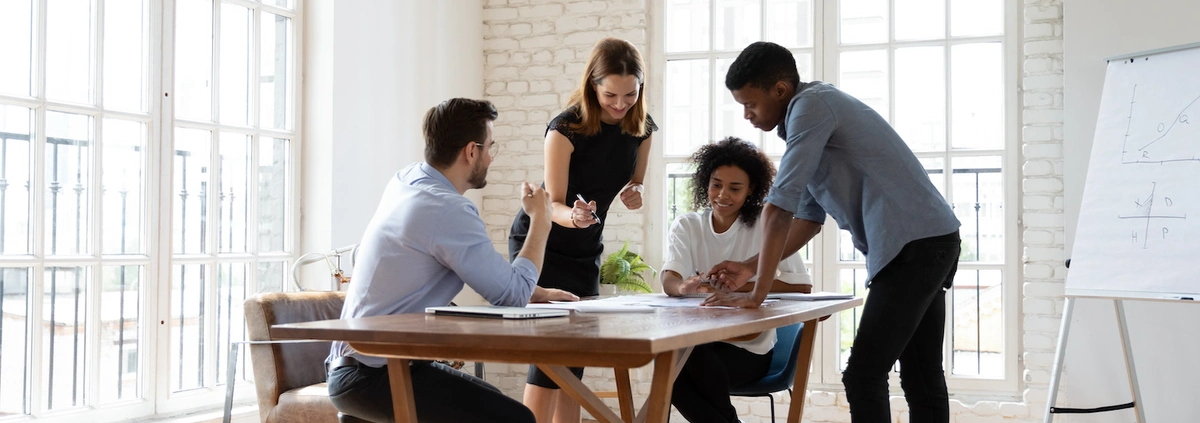 Young marketing team meeting around the table